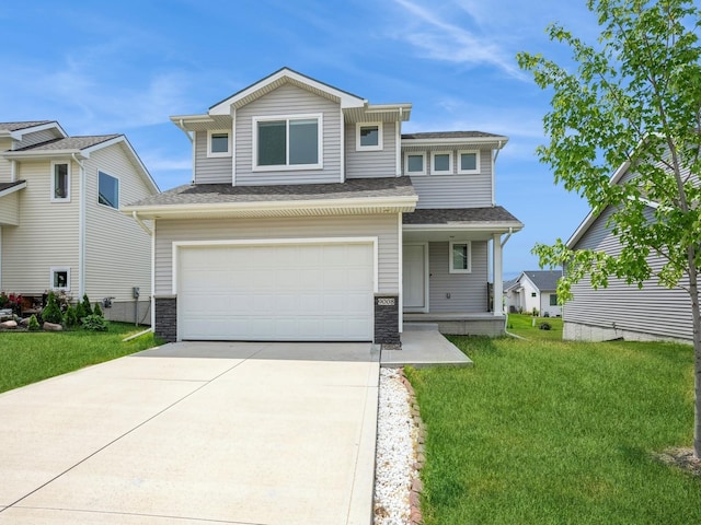 view of front of house with a garage and a front yard