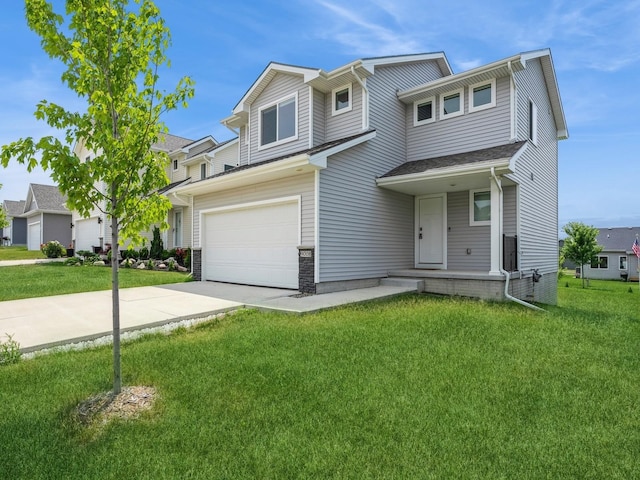 view of front of property featuring a garage and a front yard