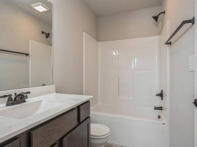 full bathroom featuring vanity, tub / shower combination, and toilet