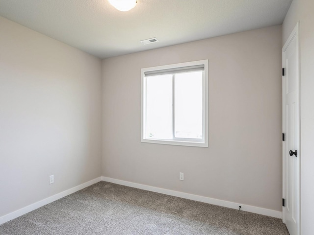 unfurnished room with carpet flooring