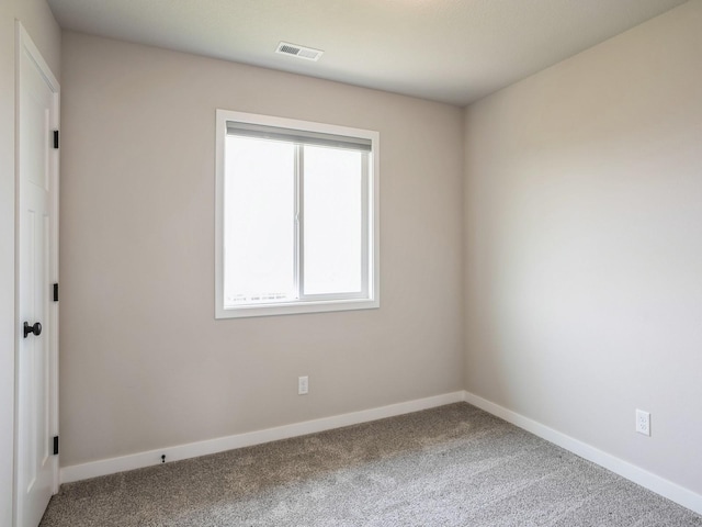 unfurnished room with carpet flooring