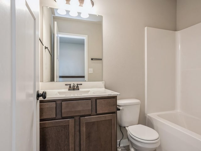 full bathroom with vanity, shower / washtub combination, and toilet