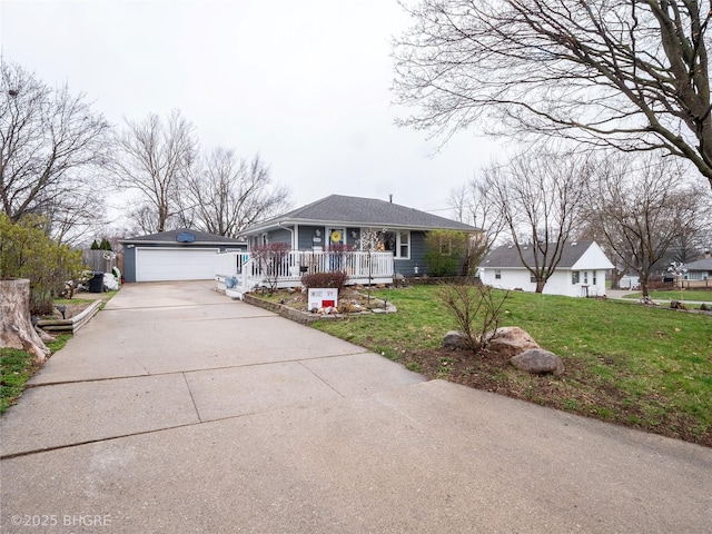 ranch-style home featuring a garage, a front yard, and covered porch