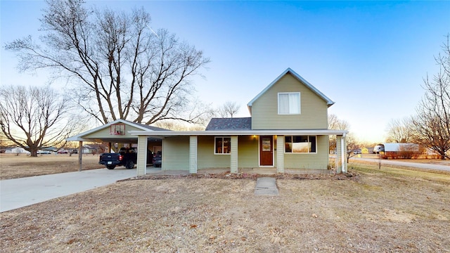 view of front of house featuring a carport and covered porch