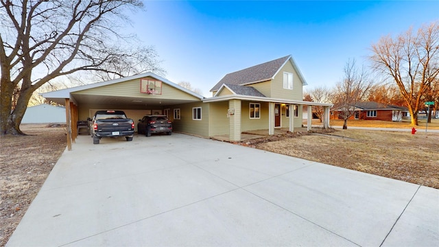 view of front of home with a carport and covered porch