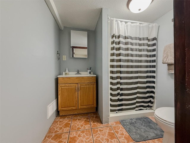 bathroom featuring vanity, toilet, a shower with shower curtain, and a textured ceiling