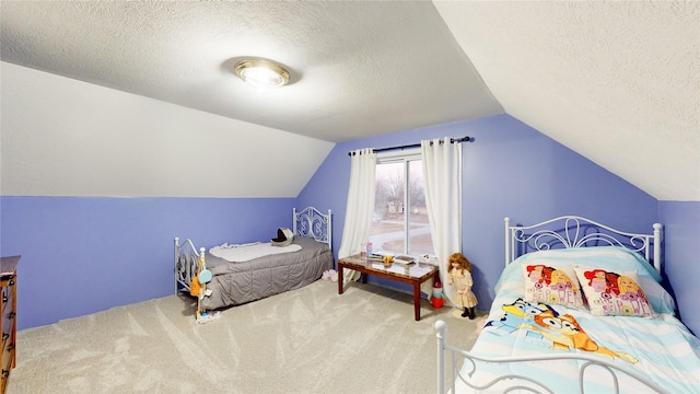 bedroom featuring carpet, lofted ceiling, and a textured ceiling