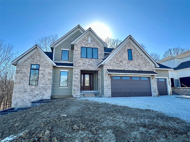 view of front of property featuring a garage and driveway