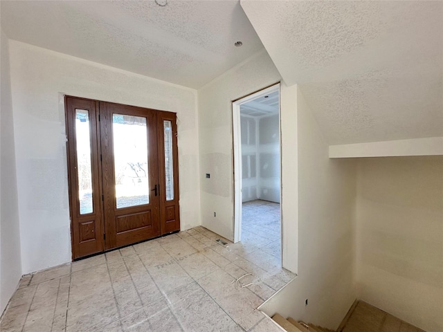 entrance foyer with a textured ceiling