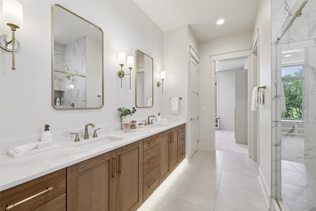 10430 Thorne Dr, West Des Moines, IA 50266 - full bath featuring double vanity, a marble finish shower, and tile patterned floors