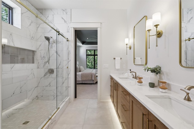10430 Thorne Dr, West Des Moines, IA 50266 - ensuite bathroom with a marble finish shower, double vanity, and tile patterned floors