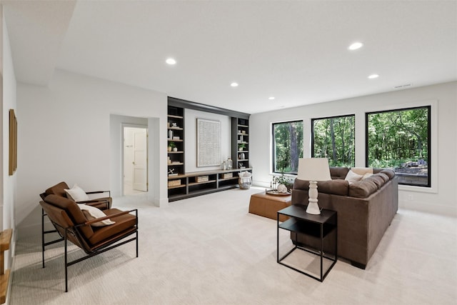 10430 Thorne Dr, West Des Moines, IA 50266 - living area with recessed lighting, built in features, and light carpet