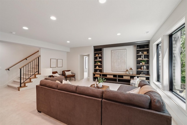 10430 Thorne Dr, West Des Moines, IA 50266 - living area featuring recessed lighting, stairway, built in features, and light colored carpet