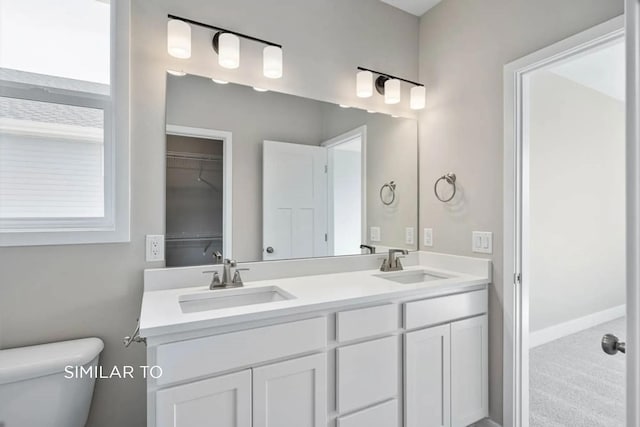 bathroom with vanity and toilet