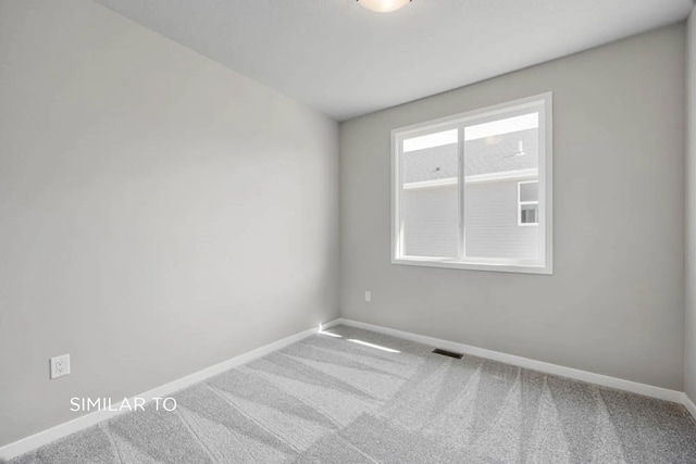 empty room with carpet floors