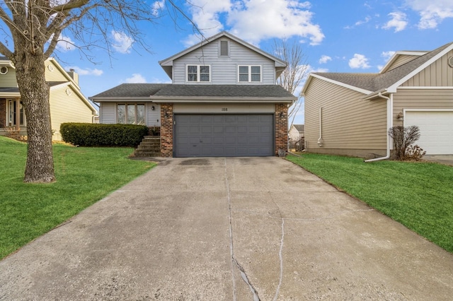 view of front of property featuring a garage and a front yard