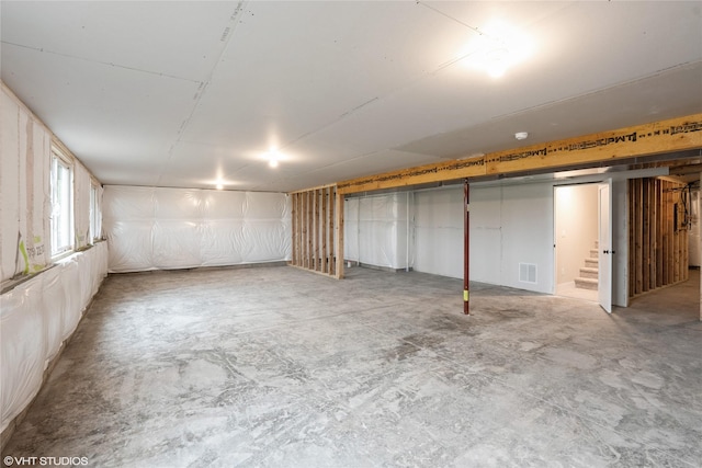 below grade area featuring visible vents and stairs