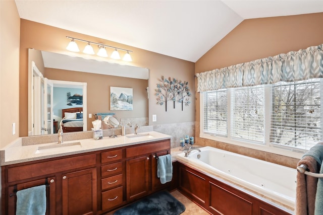 14102 Ridgemont Dr, Urbandale, IA 50323 - ensuite bathroom with a whirlpool tub, vaulted ceiling, connected bathroom, and a sink
