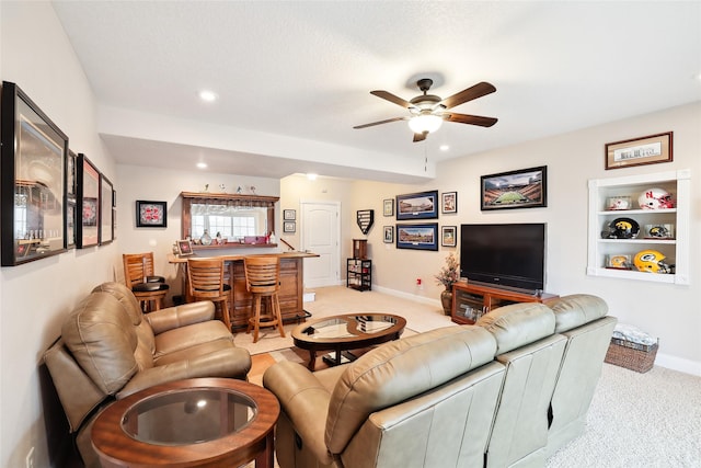 14102 Ridgemont Dr, Urbandale, IA 50323 - living room with a ceiling fan, bar, light colored carpet, baseboards, and recessed lighting