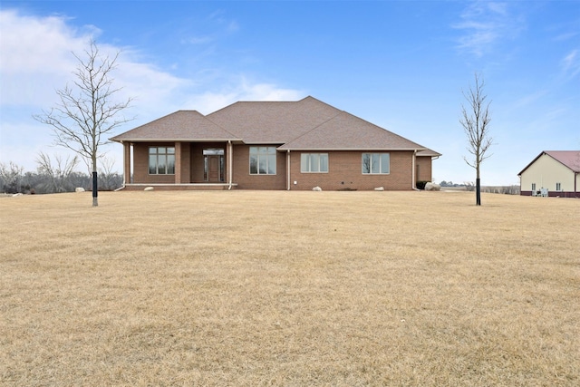 exterior space with a front yard and a porch