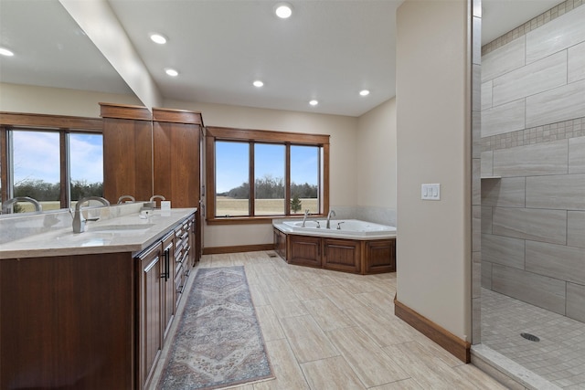 bathroom featuring vanity and plus walk in shower