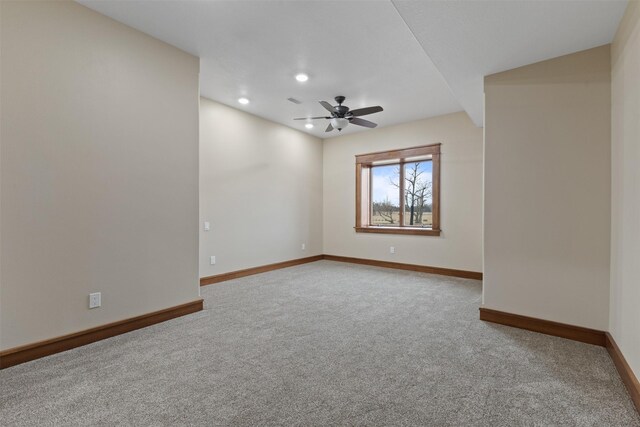 carpeted empty room with ceiling fan