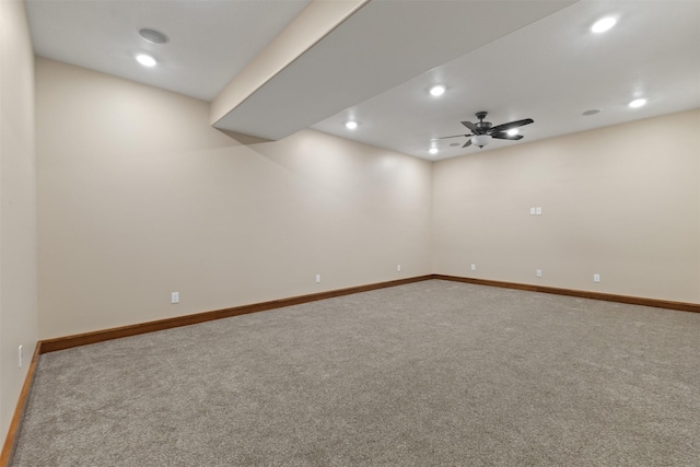 carpeted empty room featuring ceiling fan