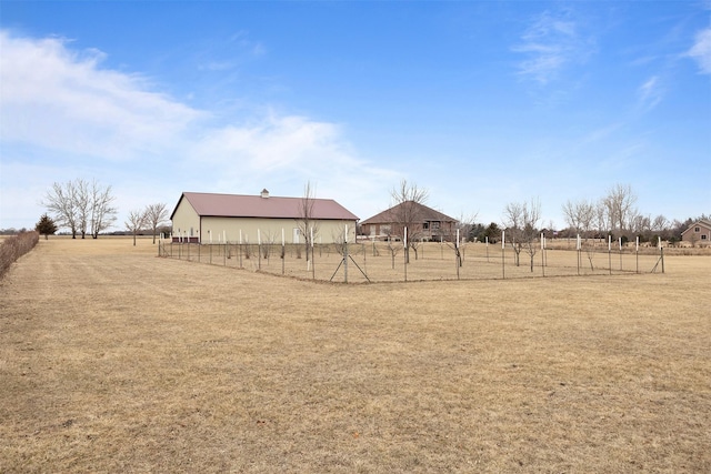 view of yard with a rural view