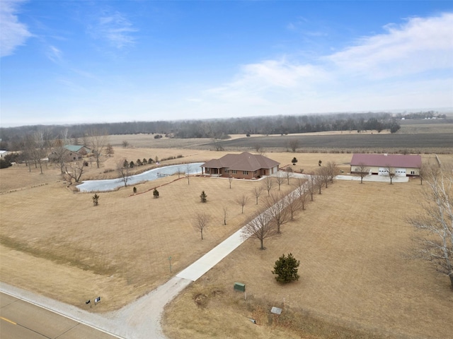 birds eye view of property with a rural view