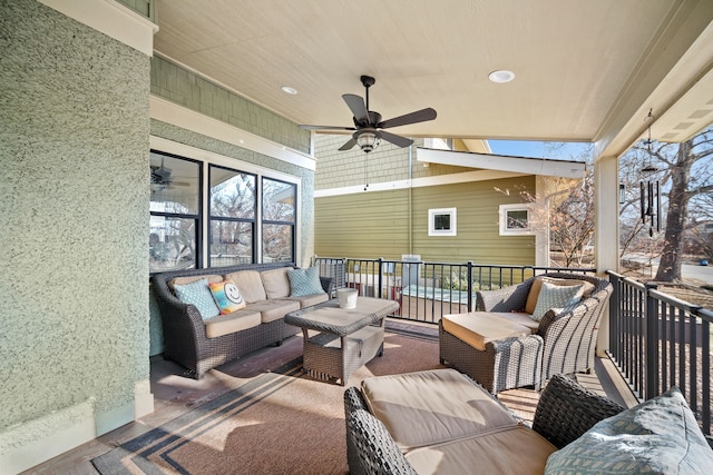 view of patio with a balcony, outdoor lounge area, and ceiling fan