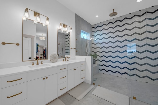 bathroom with vanity and tiled shower