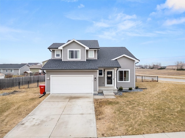 view of front of home with a garage and a front lawn