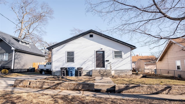 rear view of property featuring central AC