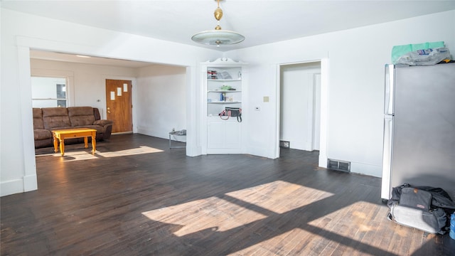 living room with dark hardwood / wood-style flooring