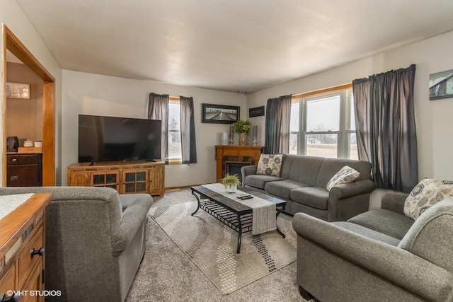 living room featuring light carpet and plenty of natural light