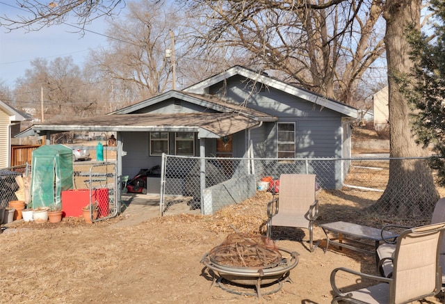 view of front of house featuring an outdoor fire pit