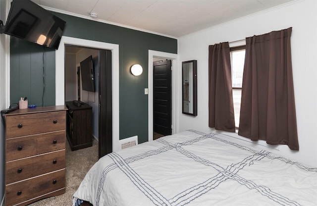 carpeted bedroom with crown molding