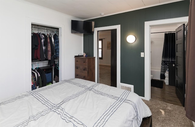 bedroom featuring ornamental molding and a closet