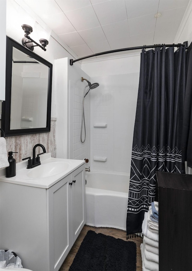 bathroom featuring vanity and shower / bath combo with shower curtain