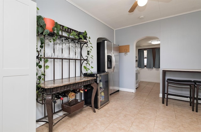 kitchen featuring crown molding, stainless steel fridge, ceiling fan, wine cooler, and light tile patterned flooring