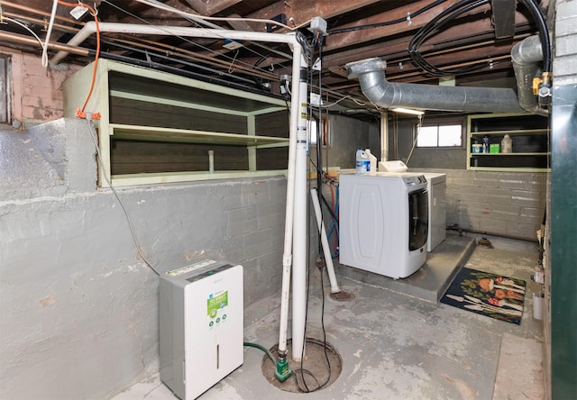 basement with washing machine and clothes dryer