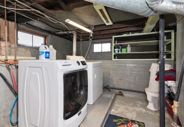 washroom with washing machine and dryer