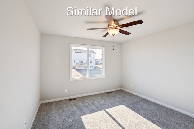 empty room featuring carpet, visible vents, ceiling fan, and baseboards