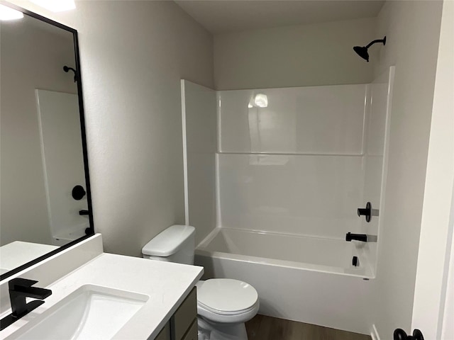 3423 5th Ave SE, Altoona, IA 50009 - bathroom with toilet, wood finished floors, vanity, and shower / washtub combination