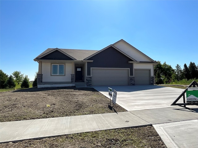 3423 5th Ave SE, Altoona, IA 50009 - ranch-style house featuring an attached garage, driveway, and stone siding