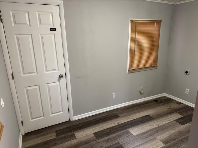 spare room featuring dark wood-type flooring