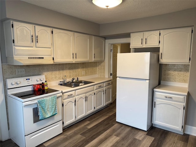 kitchen with white appliances, sink, decorative backsplash, and white cabinets