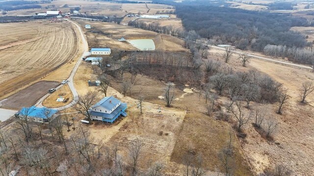 birds eye view of property with a rural view