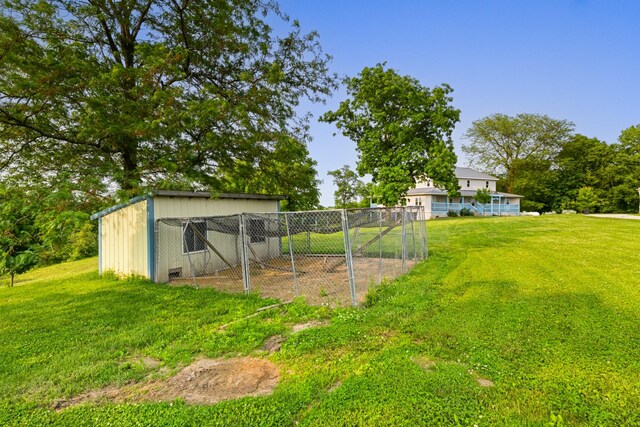 2466 655th Ave, Albia, IA 52531 - view of green lawn with an outbuilding