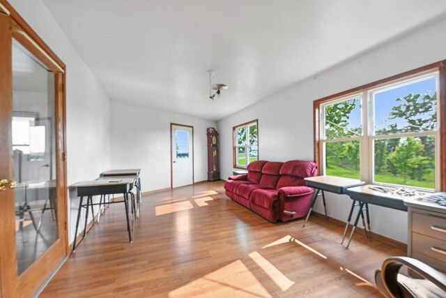 2466 655th Ave, Albia, IA 52531 - living area featuring light wood-style flooring and baseboards
